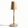 Table lamp with beige shade and metal base measuring 25 x 25 x 50cm